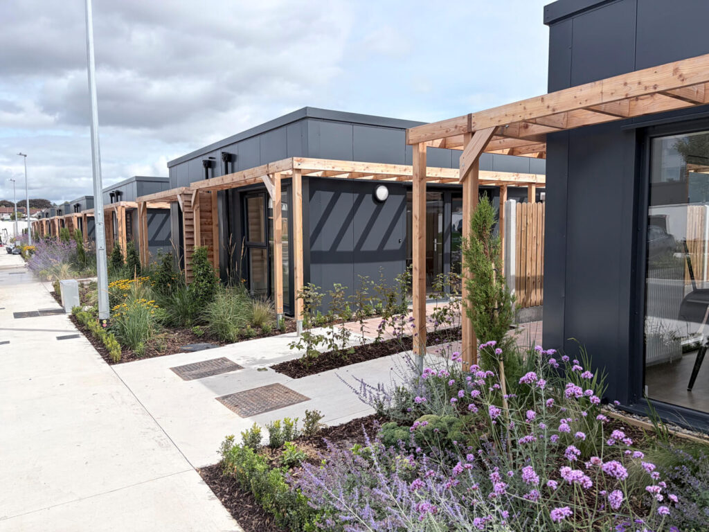 The timber pergola and planted courtyard at Estuary Way